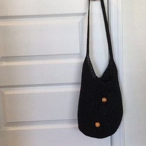 Black crochet like bucket style hobo bag